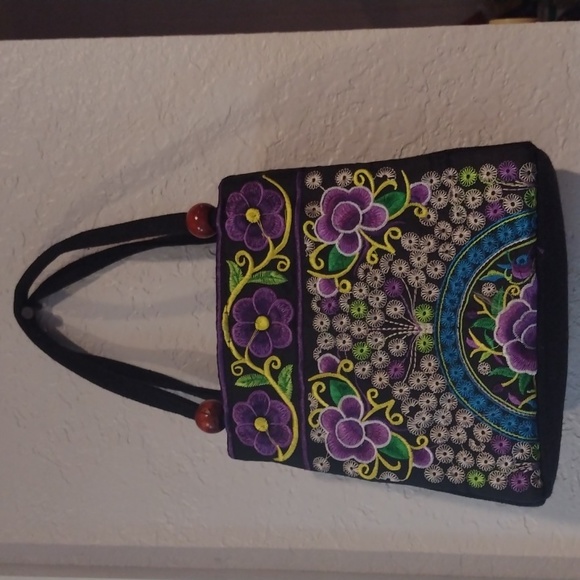 This is a cute little multicolor mini purse with purple flowers. - Picture 2 of 3
